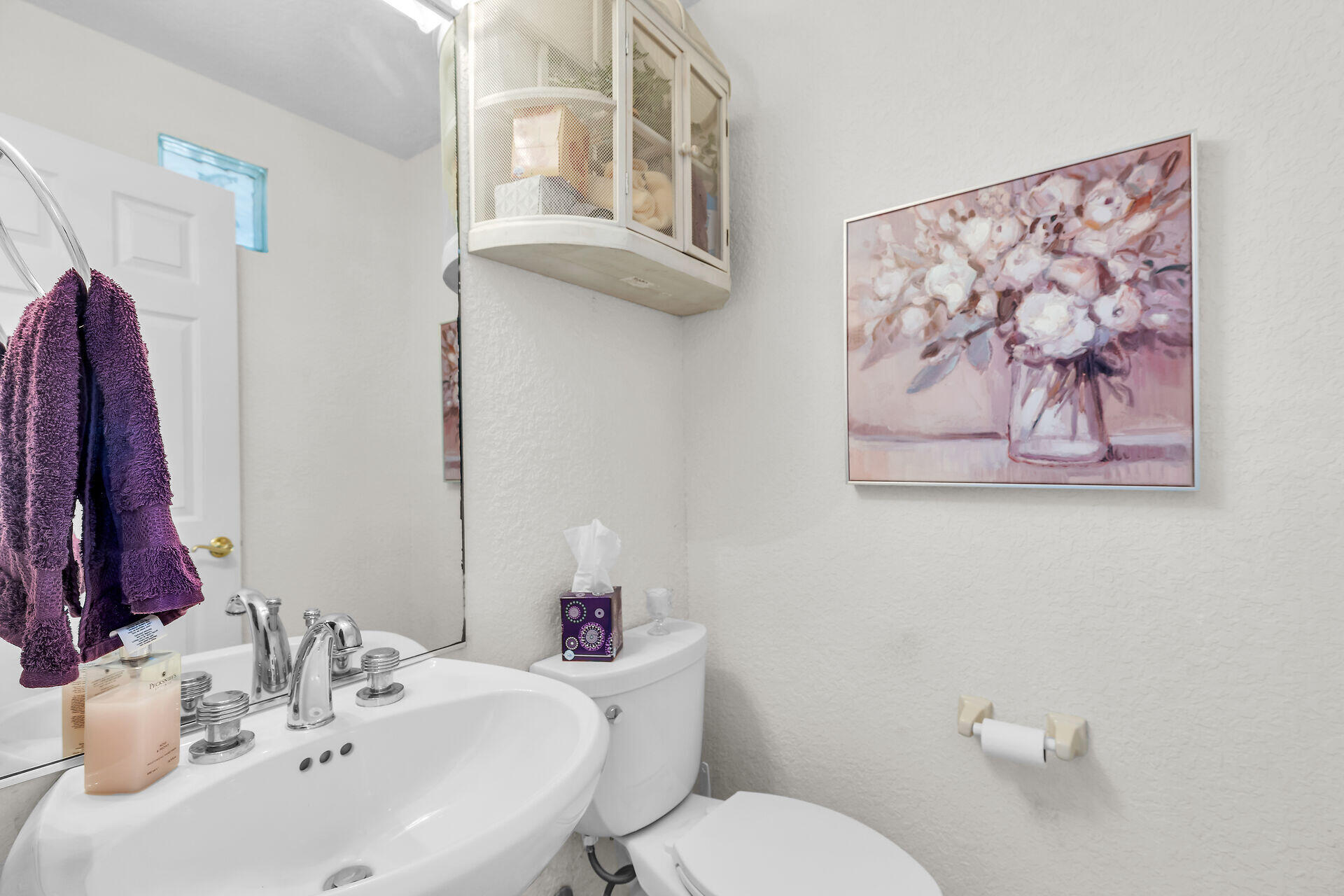 996 97th Street Marathon, FL 33050 - Photo 31 of 52 a bathroom with a sink mirror and toilet