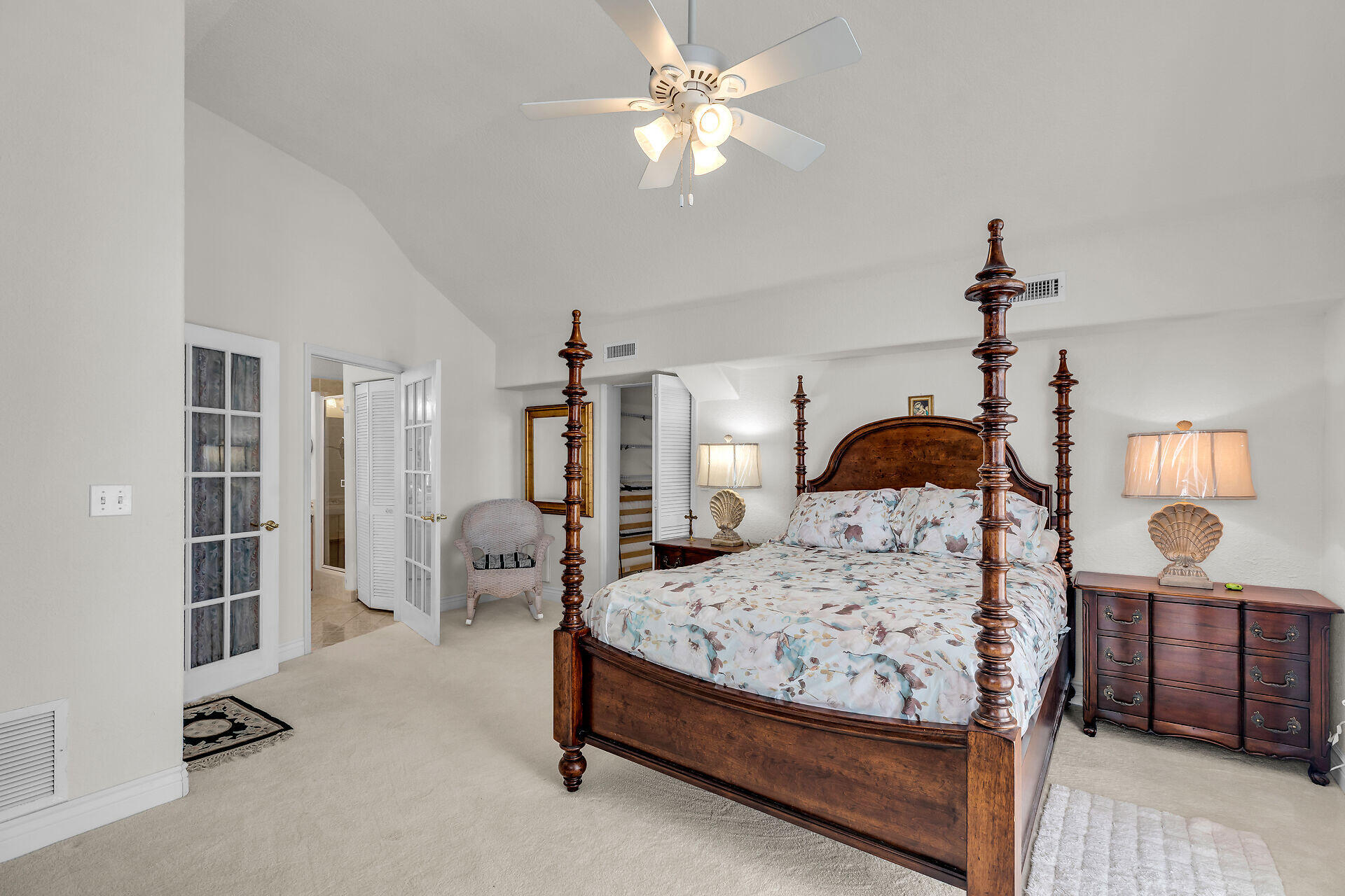 996 97th Street Marathon, FL 33050 - Photo 35 of 52 a bedroom with a bed a chandelier and dresser
