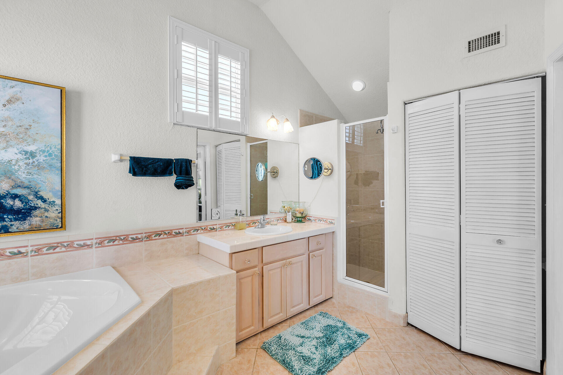 996 97th Street Marathon, FL 33050 - Photo 38 of 52 a spacious bathroom with a tub sink and mirror