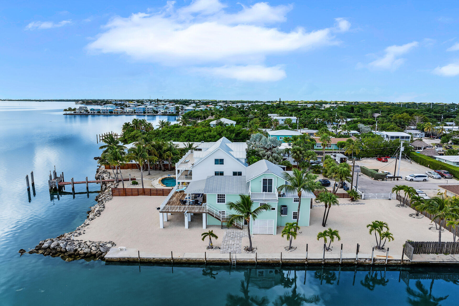 996 97th Street Marathon, FL 33050 - Photo 46 of 52 an aerial view of a house with a garden and lake view