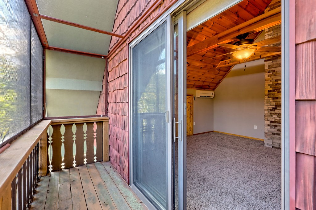 206 Peckerwood Road Hayesville, NC 28904 - Photo 32 of 75 Private deck off of Primary BR, How awesome is this? Pull the screen and enjoy the mountain air! Great little relaxation spot and book reading and coffee area!