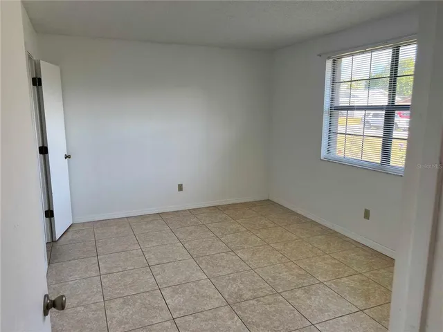 a bathroom with a granite countertop toilet sink and shower