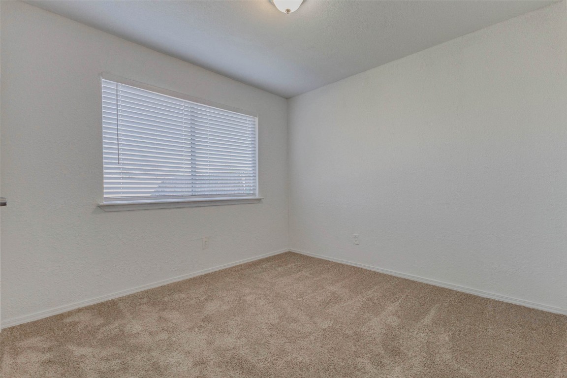 5210 Shirley Street Baytown, TX 77521 - Photo 16 of 31 an empty room with a window