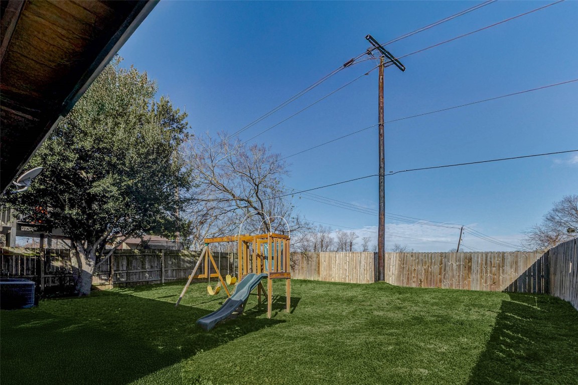 5210 Shirley Street Baytown, TX 77521 - Photo 28 of 31 a view of a chair and table in the garden