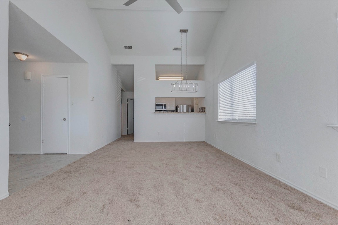 5210 Shirley Street Baytown, TX 77521 - Photo 7 of 31 an empty room with windows and cabinet