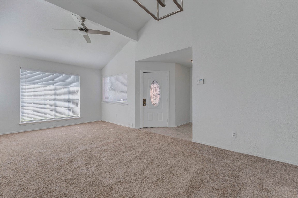 5210 Shirley Street Baytown, TX 77521 - Photo 10 of 31 an empty room with windows and cabinet