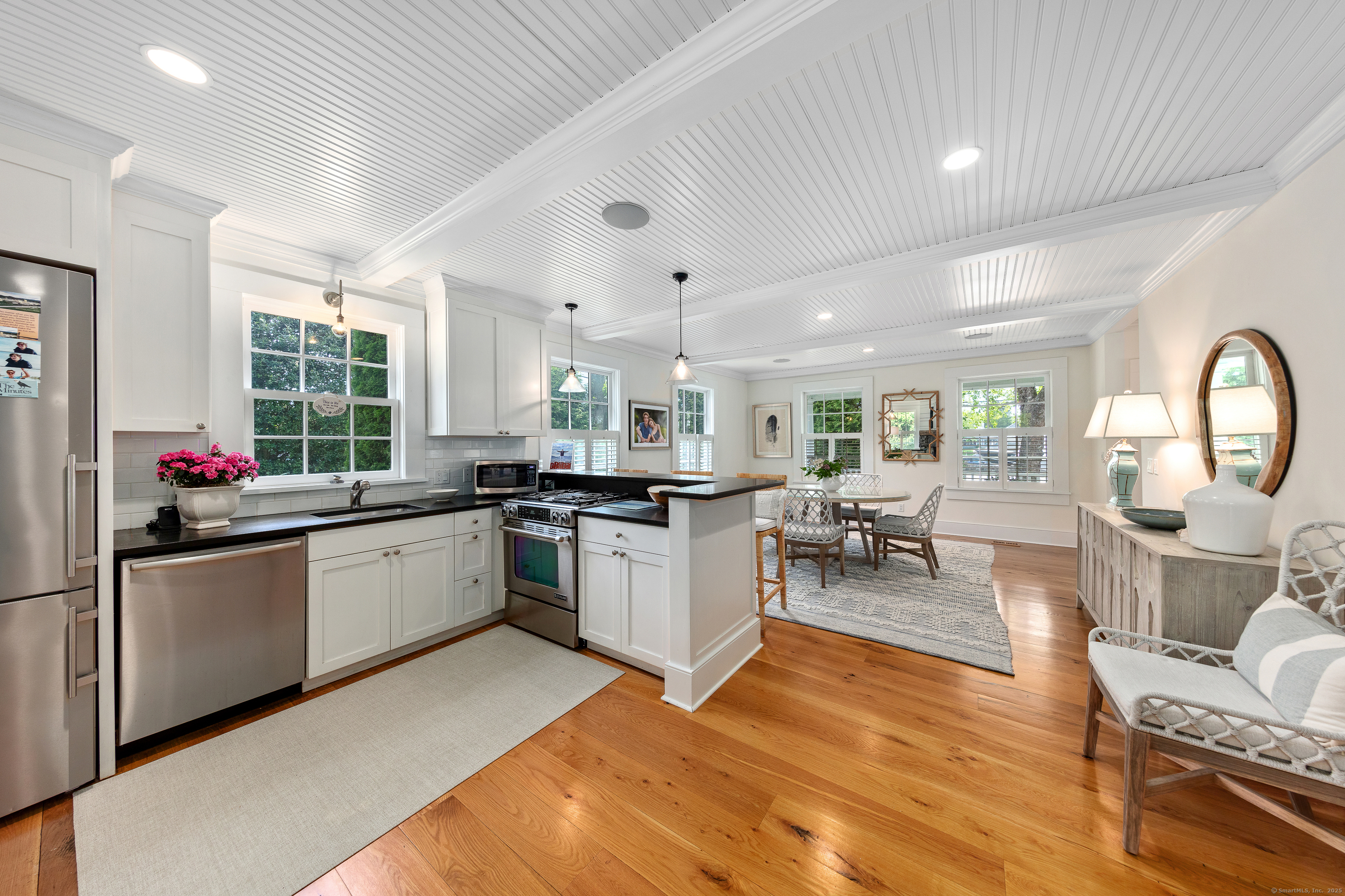 168 Rowayton Avenue Norwalk, CT 06853 - Photo 11 of 27 a kitchen with sink cabinets and wooden floor