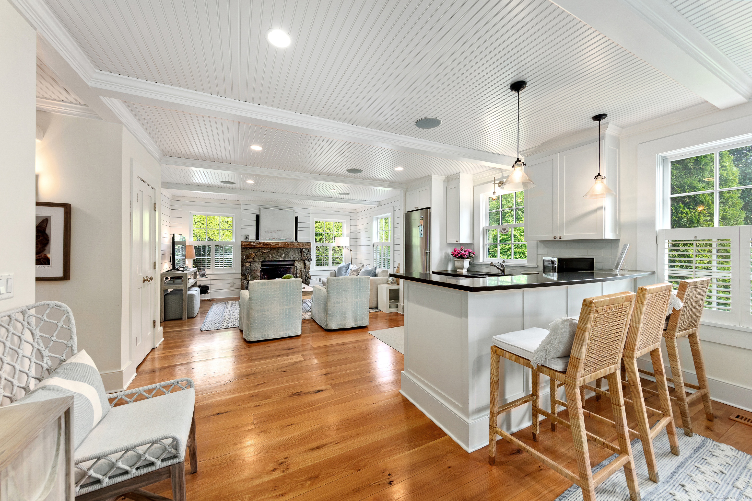 168 Rowayton Avenue Norwalk, CT 06853 - Photo 12 of 27 a kitchen with stainless steel appliances kitchen island granite countertop a table and chairs in it