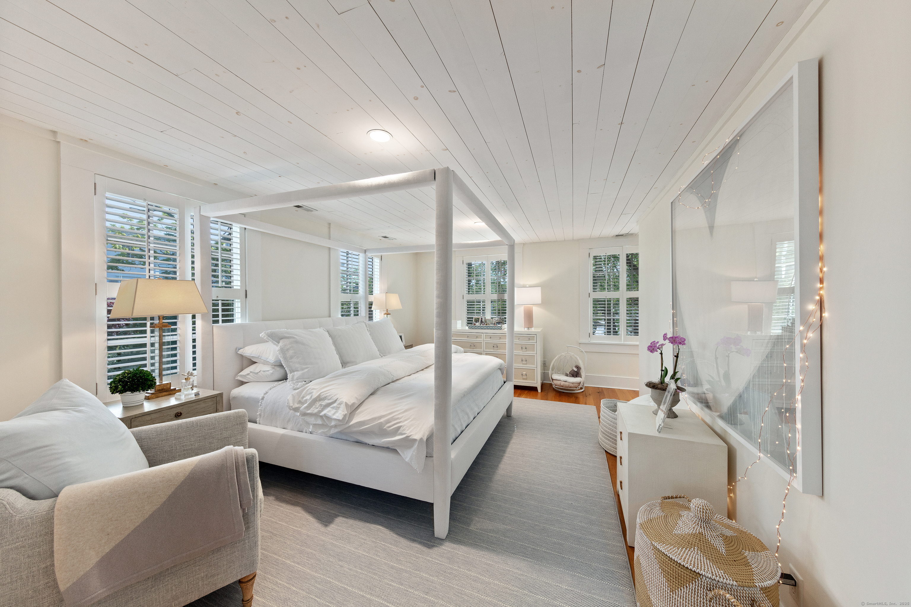 168 Rowayton Avenue Norwalk, CT 06853 - Photo 15 of 27 a bedroom with furniture and a large window