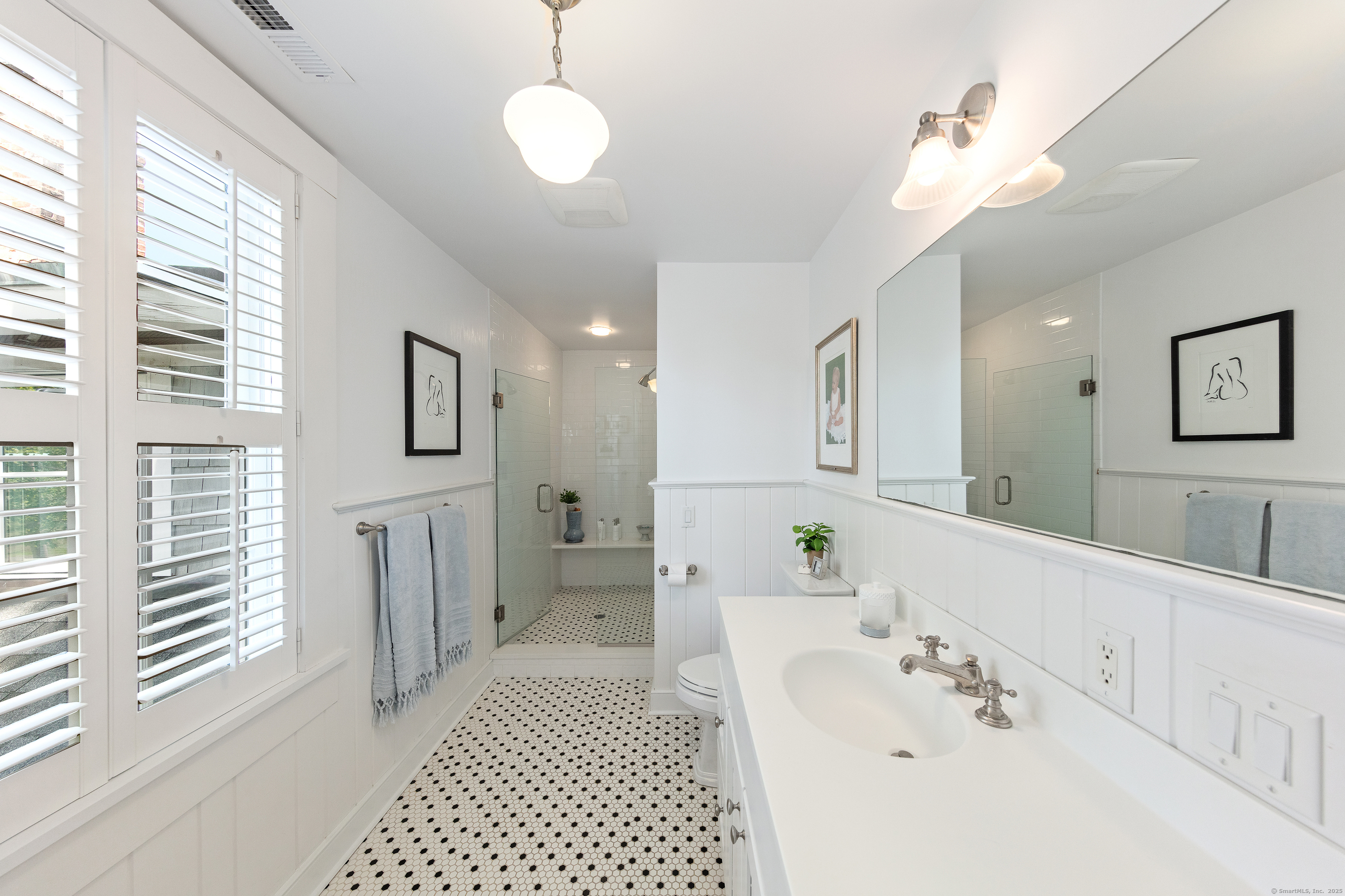 168 Rowayton Avenue Norwalk, CT 06853 - Photo 16 of 27 a bathroom with a sink a toilet and shower