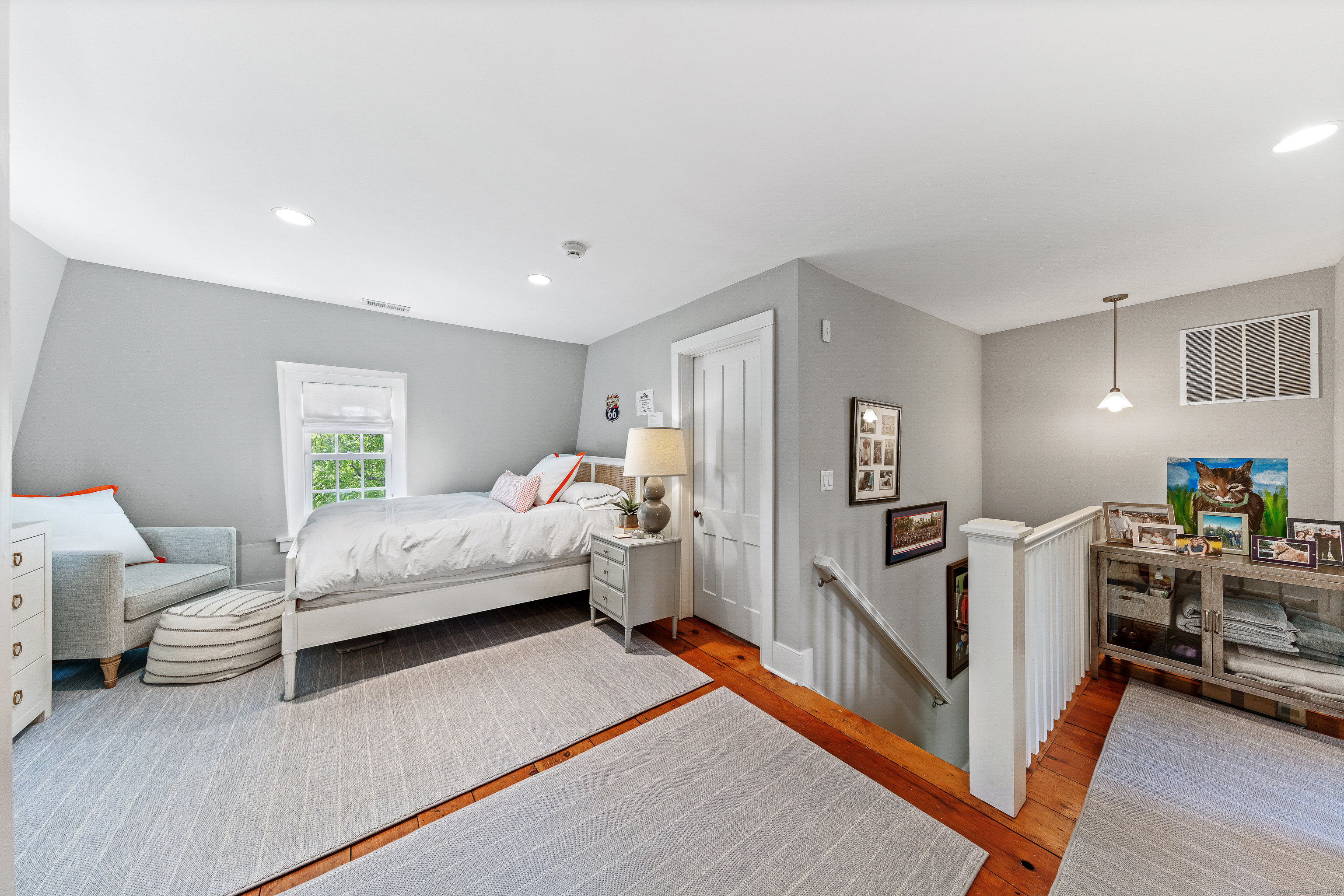 168 Rowayton Avenue Norwalk, CT 06853 - Photo 17 of 27 a bedroom with furniture and a wooden floor