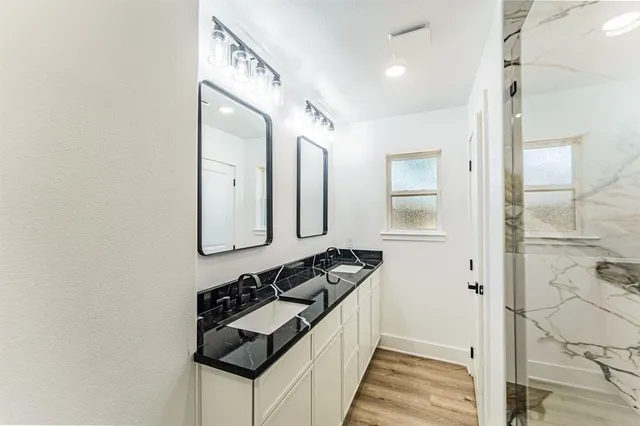 a bathroom with a sink and a mirror