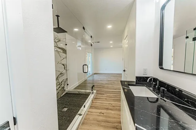 a bathroom with a sink and a mirror