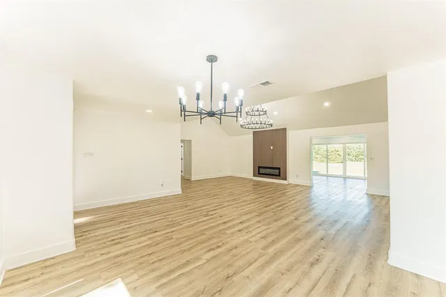 a view of a kitchen with a sink and wooden floor