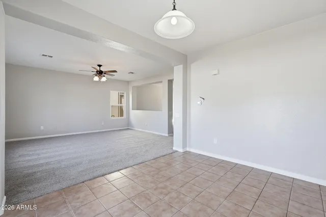 a kitchen with stainless steel appliances kitchen island granite countertop a stove a sink and a refrigerator