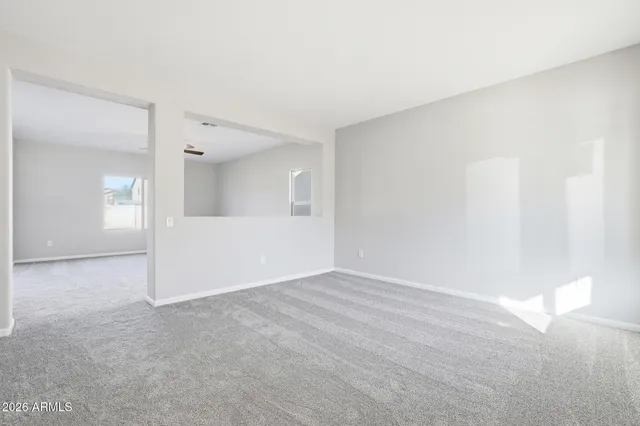 a living room with furniture and a large mirror