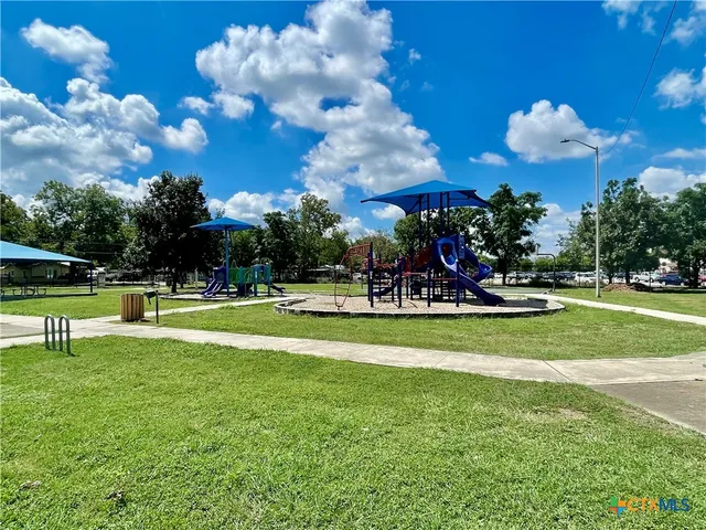 a view of a park with sitting area