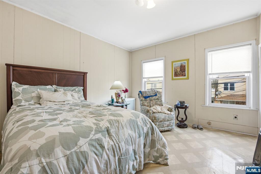 110 Tappan Street Kearny, NJ 07032 - Photo 4 of 13 a bedroom with a bed and wooden floor