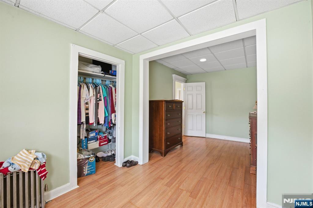 110 Tappan Street Kearny, NJ 07032 - Photo 7 of 13 a view of a hallway with wooden floor and closet