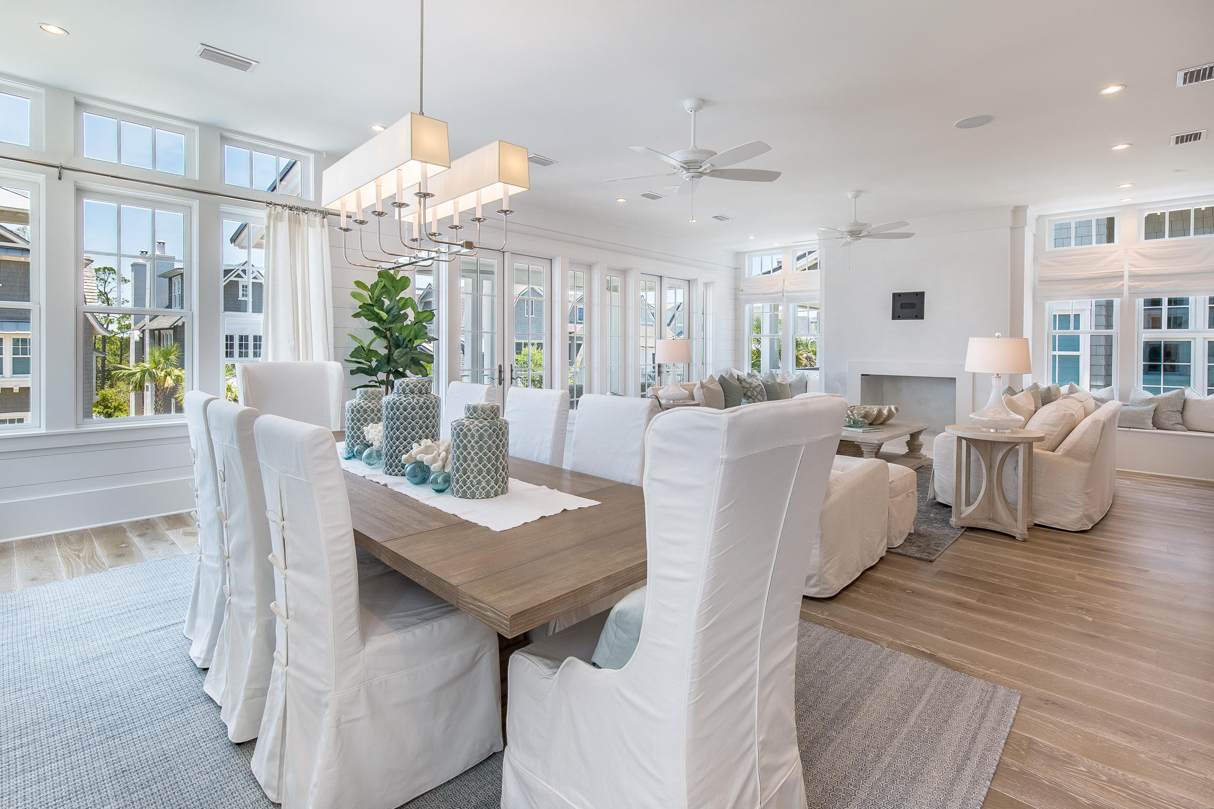 Lot 50 South Compass Point Way Watersound, FL 32461 - Photo 38 of 89 a view of a dining room with furniture large windows and wooden floor
