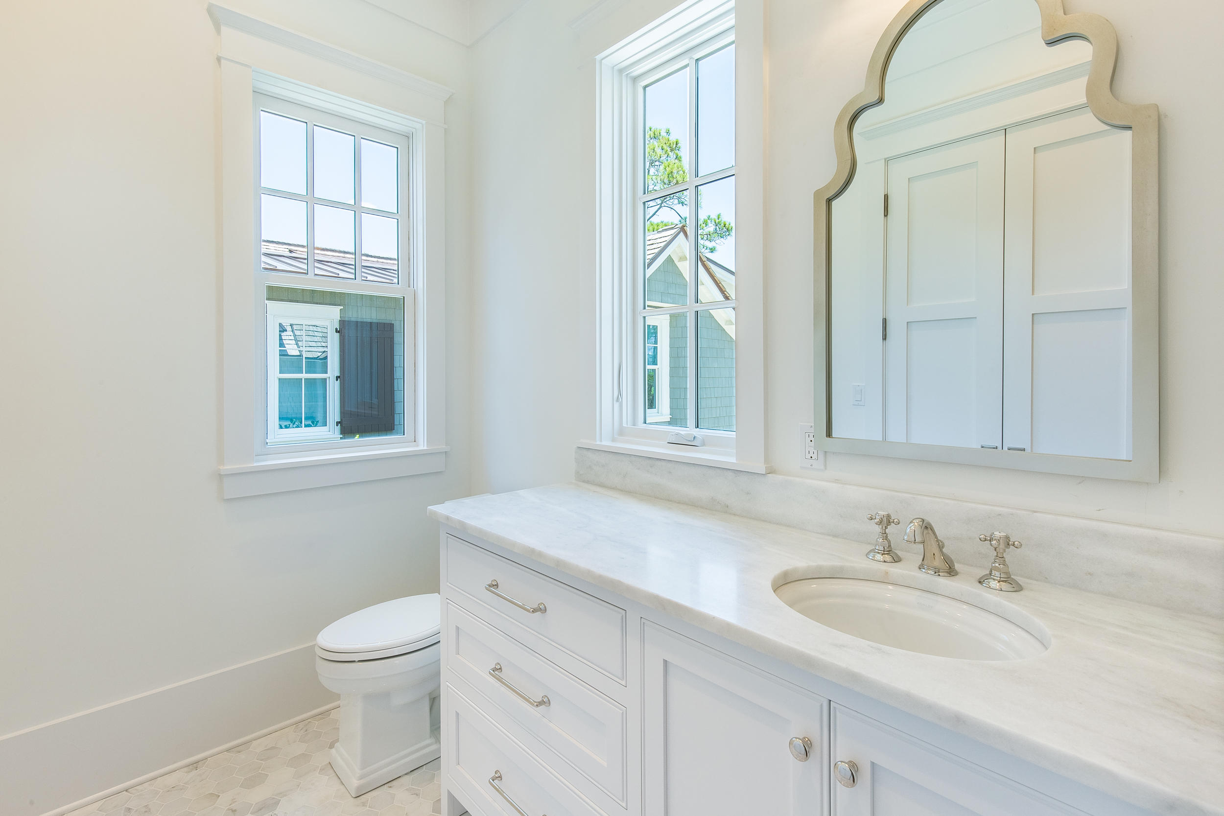 Lot 50 South Compass Point Way Watersound, FL 32461 - Photo 49 of 89 a bathroom with a granite countertop sink toilet and a window