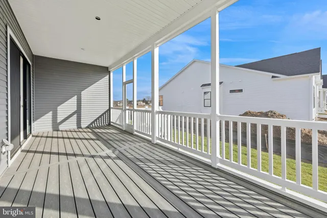 a view of balcony with wooden floor