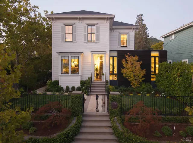 a front view of a house with garden