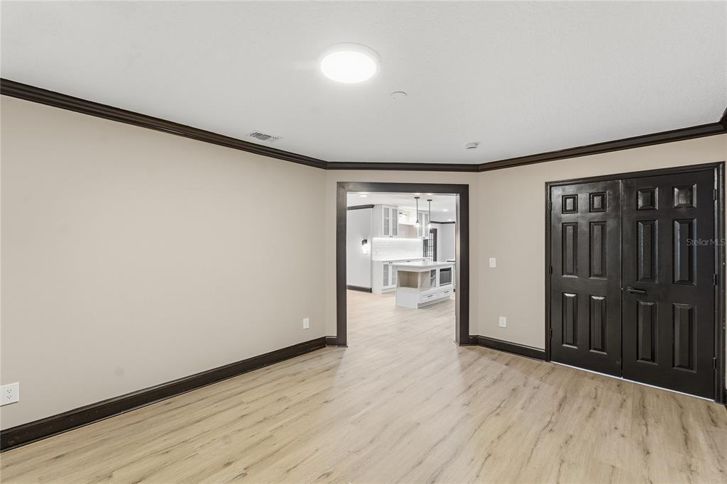 14728 Henson Road Orlando, FL 32832 - Photo 14 of 70 a view of a room with wooden floor