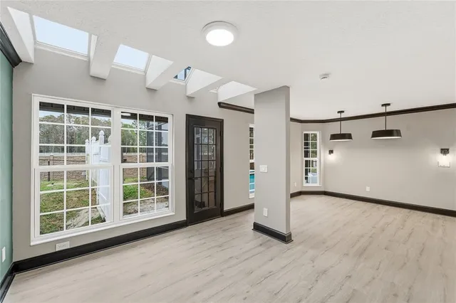 a kitchen with stainless steel appliances a sink and a refrigerator