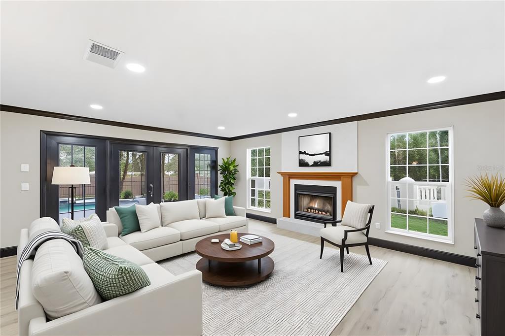 14728 Henson Road Orlando, FL 32832 - Photo 31 of 70 a living room with furniture and a fireplace