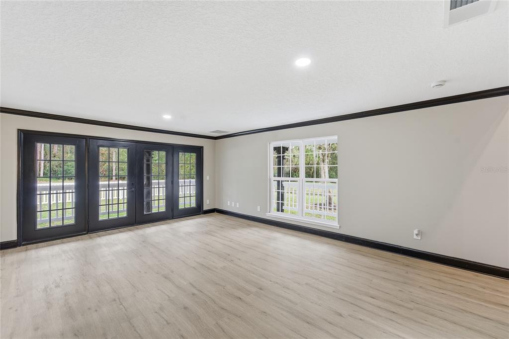 14728 Henson Road Orlando, FL 32832 - Photo 36 of 70 wooden floor in an empty room with a window