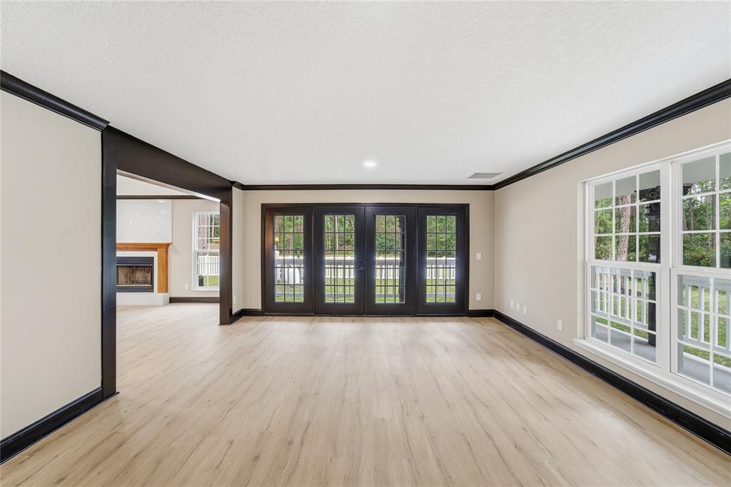 14728 Henson Road Orlando, FL 32832 - Photo 37 of 70 wooden floor in an empty room with a window