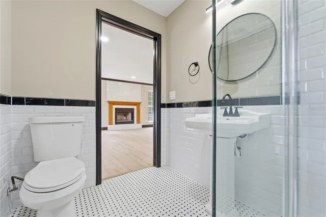 a bedroom with a large bed and a couch