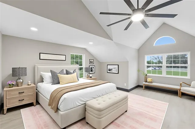 a living room with patio furniture and a floor to ceiling window