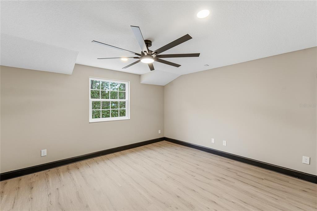 14728 Henson Road Orlando, FL 32832 - Photo 67 of 70 wooden floor in an empty room with a window