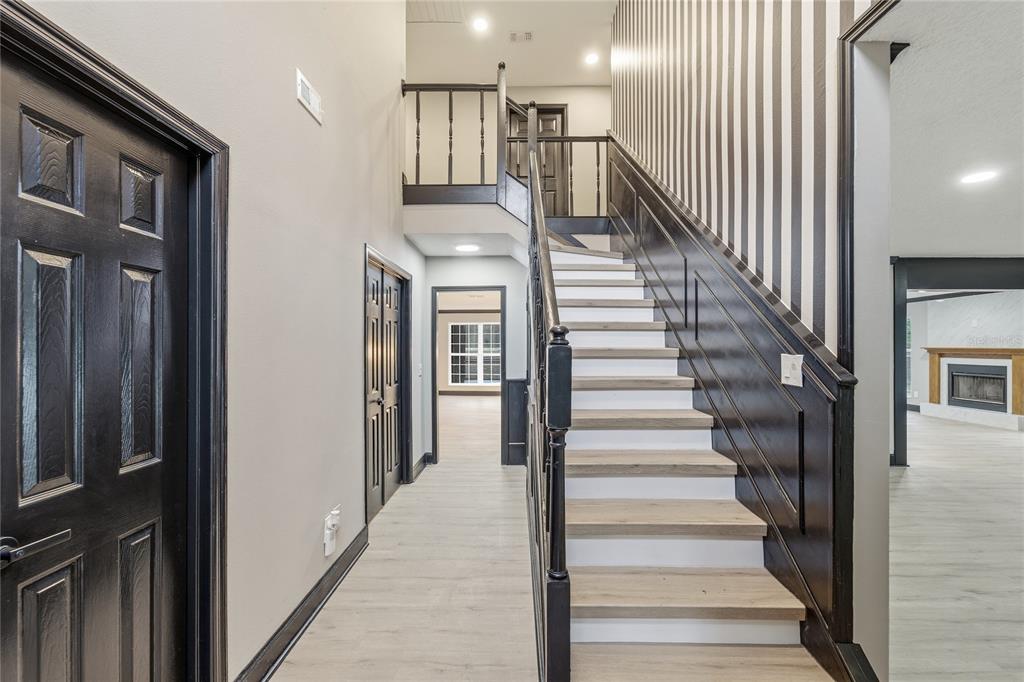 14728 Henson Road Orlando, FL 32832 - Photo 7 of 70 a view of entryway and hall with wooden floor
