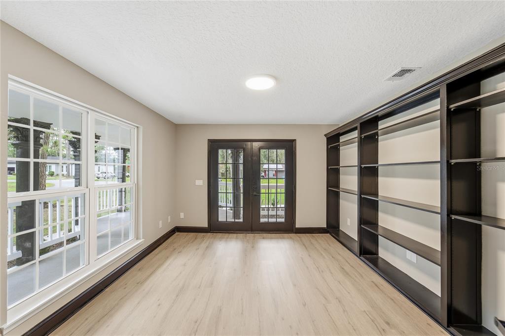 14728 Henson Road Orlando, FL 32832 - Photo 9 of 70 a view of empty room with wooden floor and fan