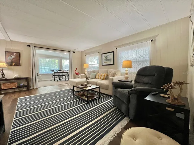 a kitchen with refrigerator and cabinets