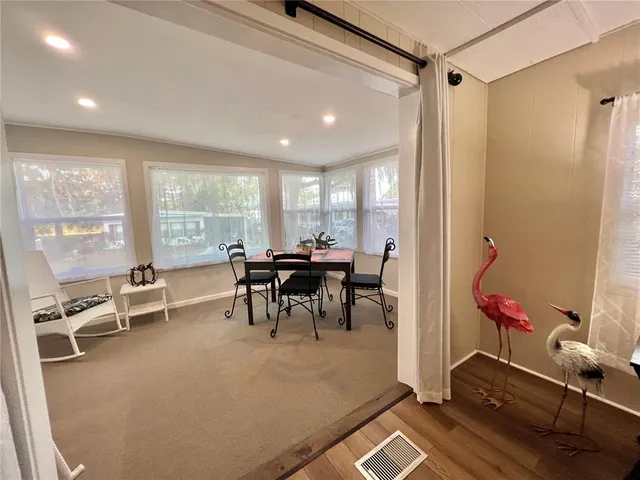 a bedroom with a bed and a night stand