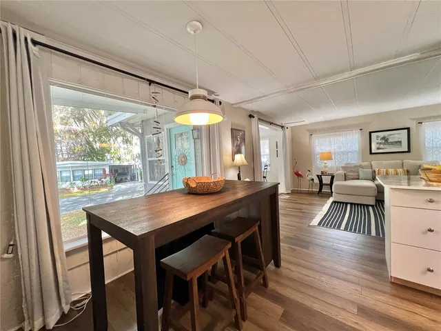 a kitchen with stainless steel appliances granite countertop a stove and a refrigerator