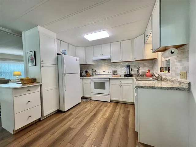 a dining room with a table and chairs