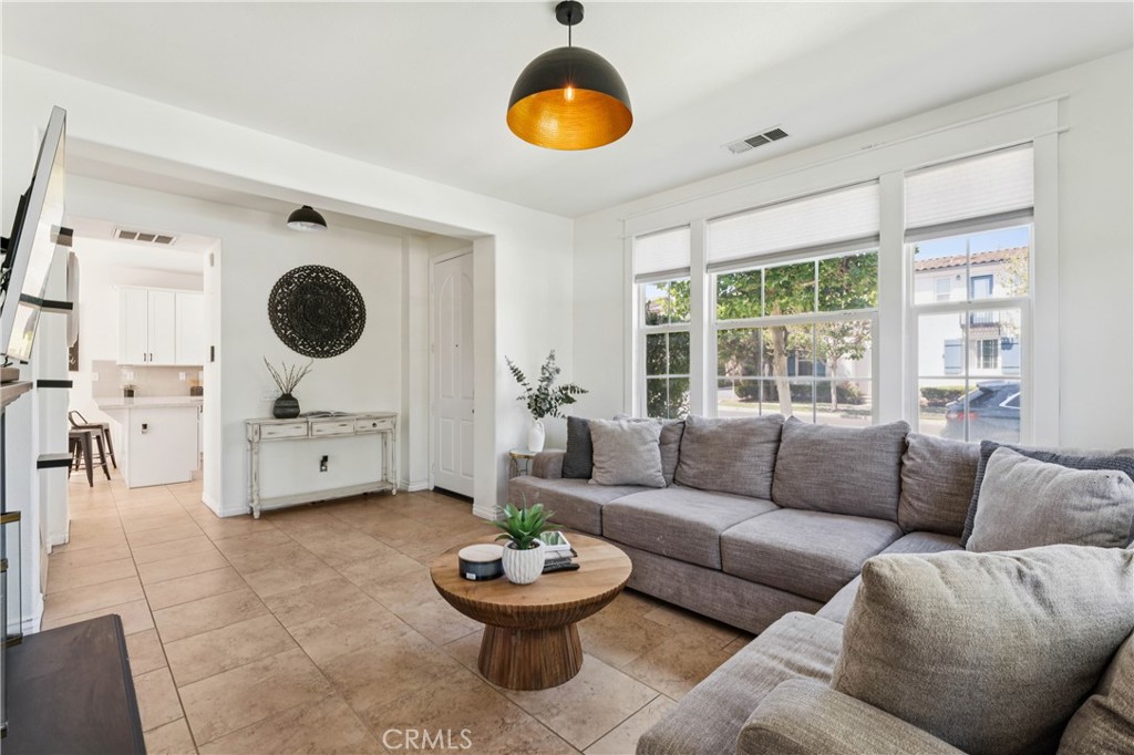 4155 Windspring Street Corona, CA 92883 - Photo 17 of 38 a living room with furniture and a large window