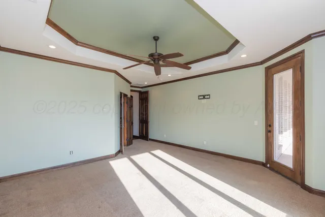 a white bath tub sitting in a bathroom next to a window