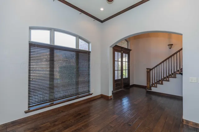 a view of a livingroom with an empty space and a fireplace