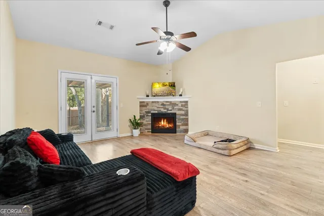 a living room with furniture and a fireplace