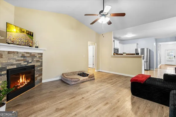 a living room with furniture and a fireplace