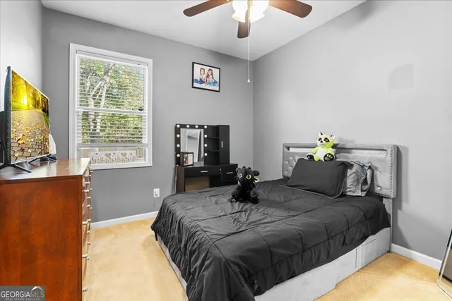 a bedroom with a bed and window