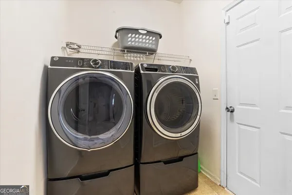 a utility room with dryer and washer