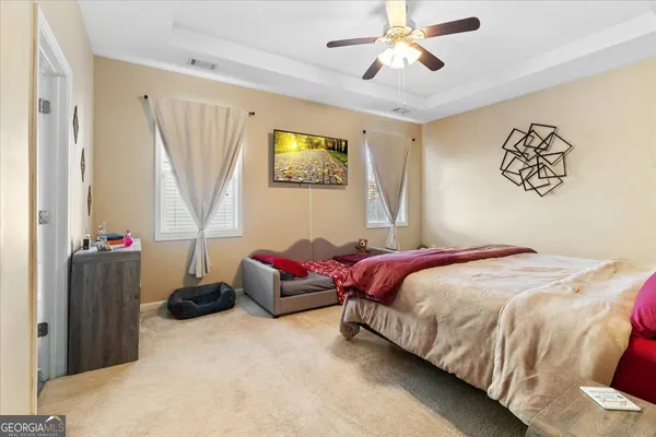 a bedroom with bed and a window