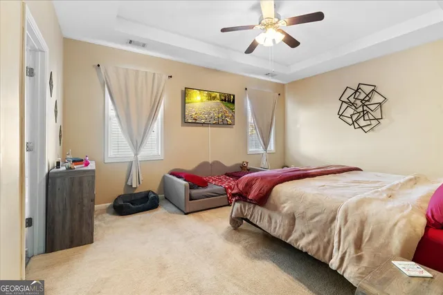 a bedroom with bed and a window